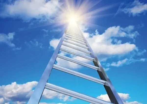 Looking up a ladder to the sunny sky