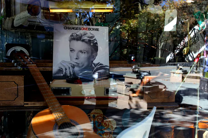 Record store window with Changes, Bowie and a guitar
