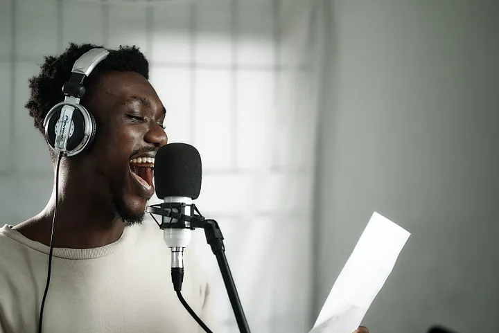 Man singing into a microphone