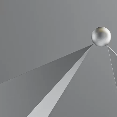 Greyscale image of two pointed spires balancing a ball.