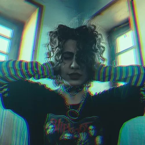 Punk woman holding her hands to her ears