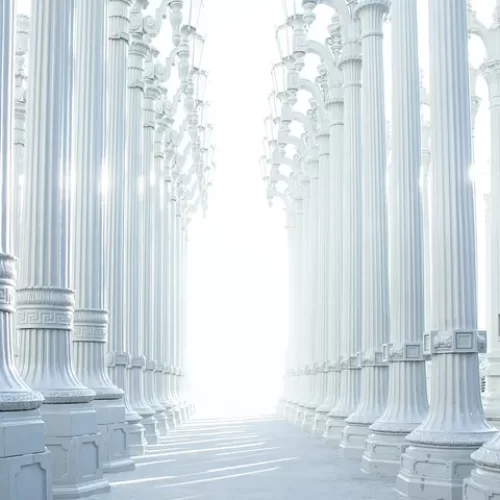A hallway of silver white pillars